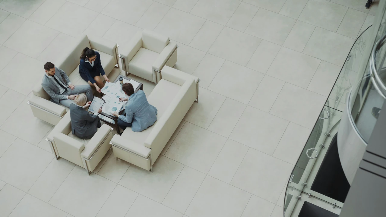 Business meeting around a table on sofas.