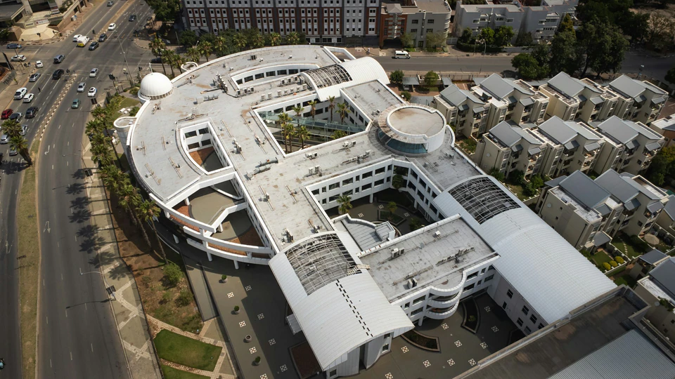 An aerial view of a building in a city.