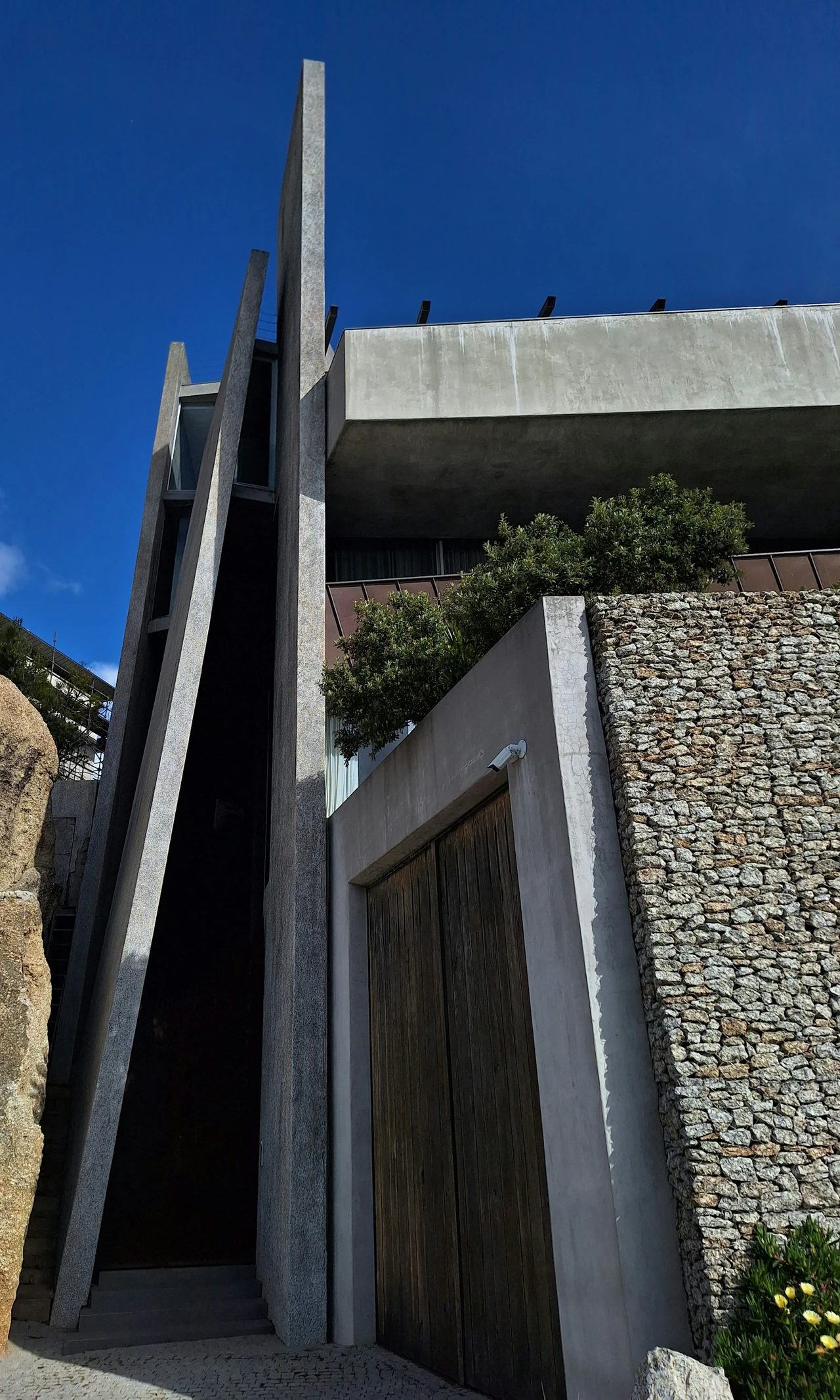 A tall building with a very tall door.