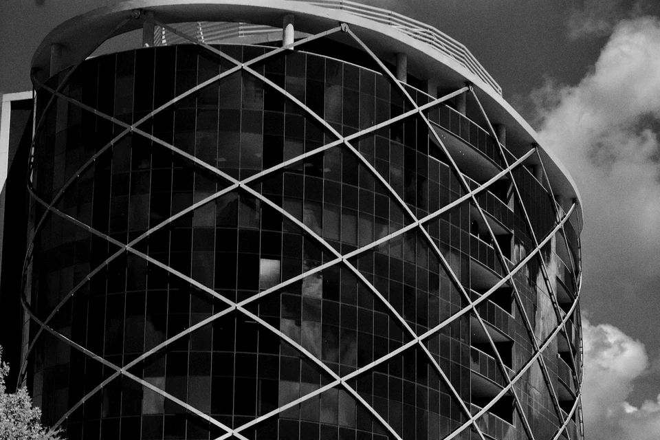 A black and white photo of a large building.